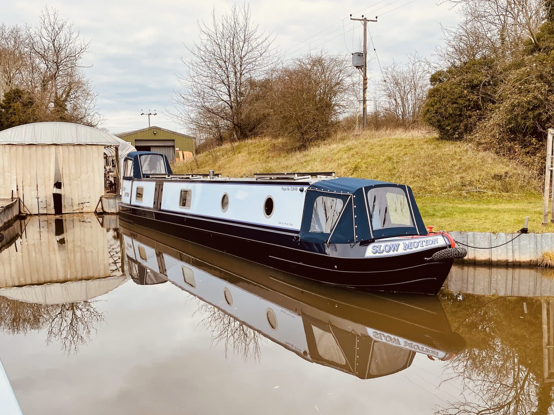 moored 'slow motion' hand painted custom canal boat exterior