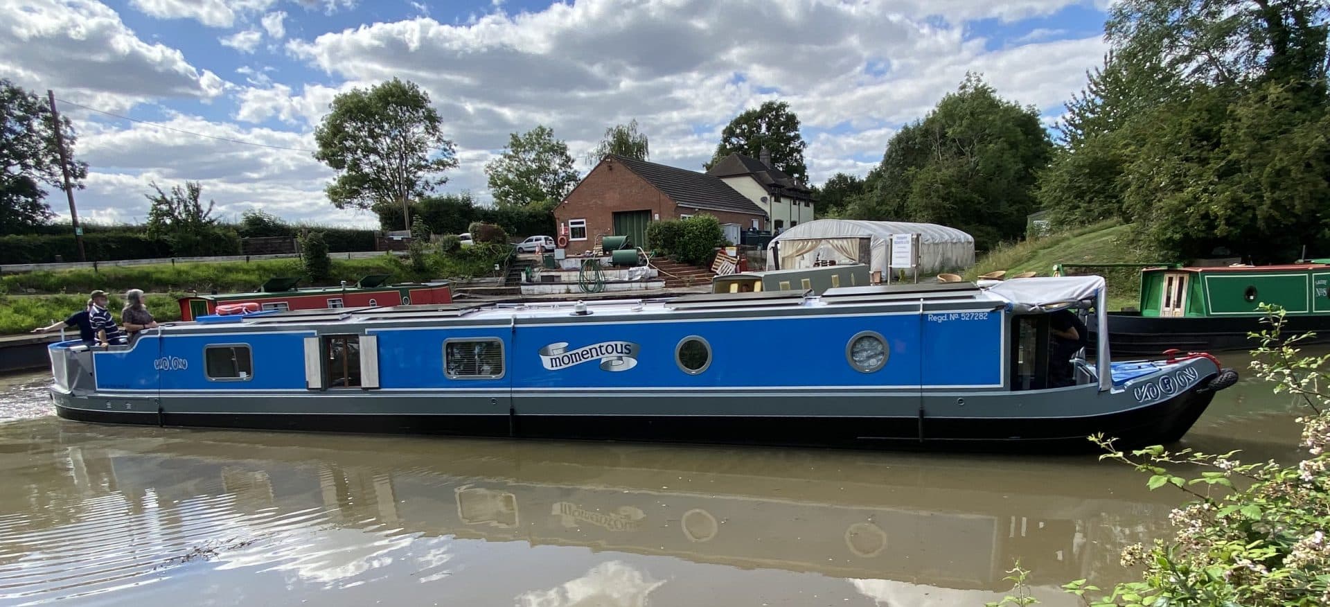 'momentous' custom boat build exterior side view